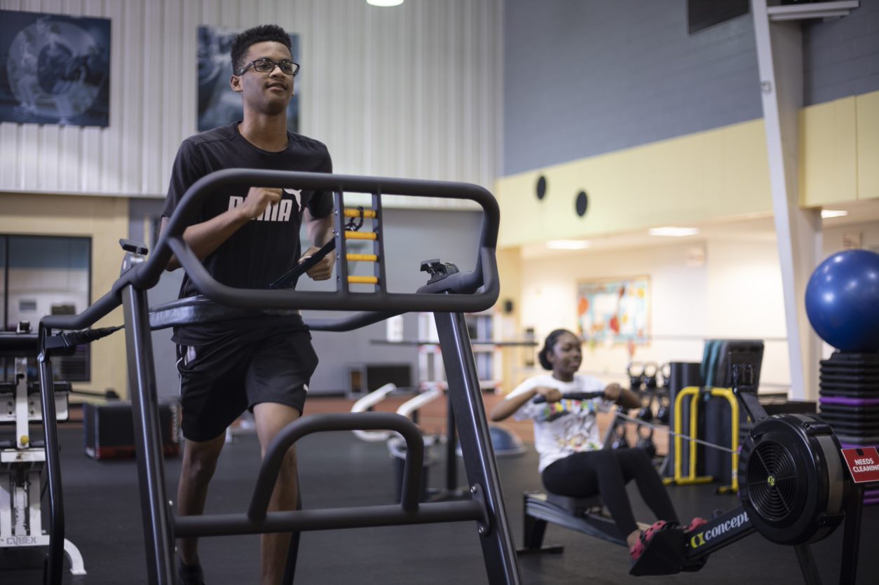 Teenager working out on treadmill