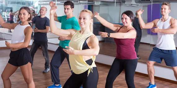 group of six people doing barre