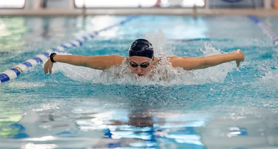 Girl doing the butterfly in a pool