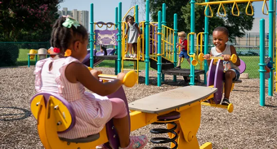 Two children playing on a playground