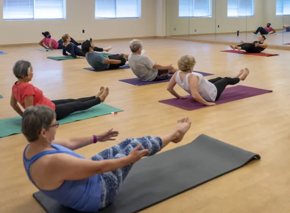 Active older adults doing yoga