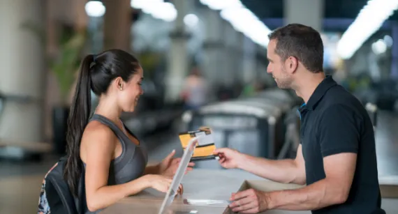 Membership staff showing a info card