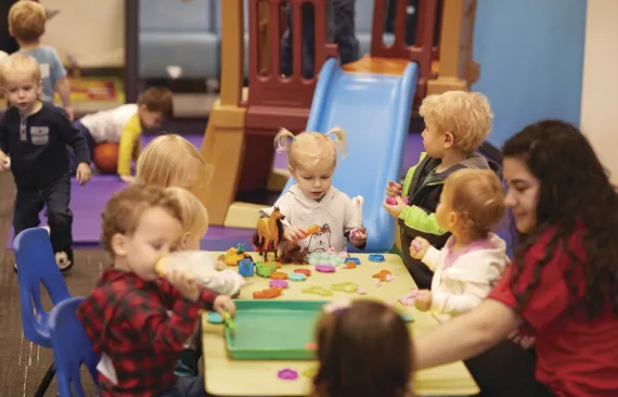 Kids playing at table.