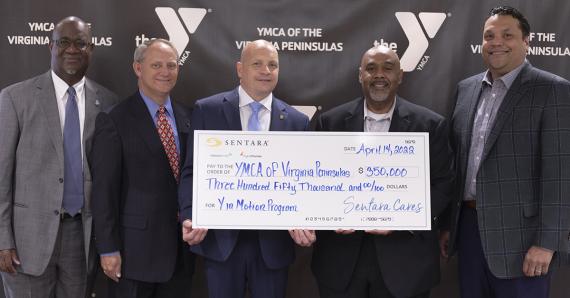 board members holding a check from Sentara hospital 