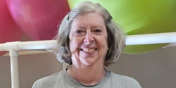 senior smiling at the camera