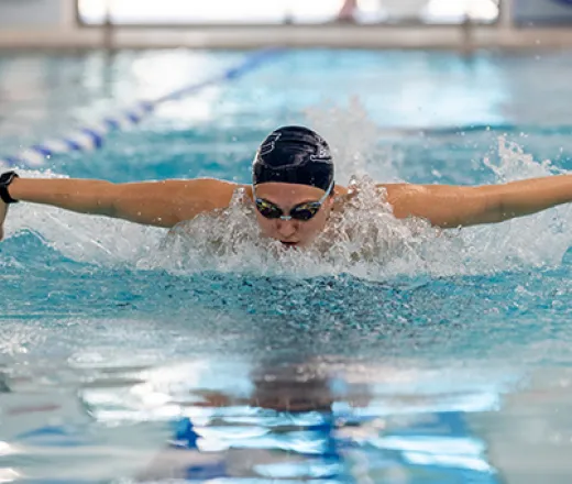 Girl doing the butterfly in a pool