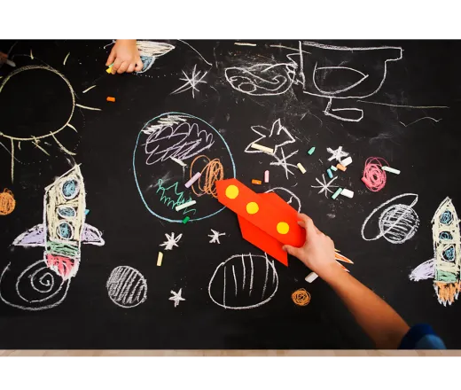 chalk drawings of outer space and rockets