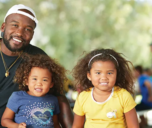 man with his two daughters