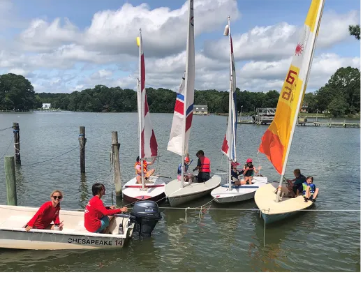 children learning how to sail a sailboat