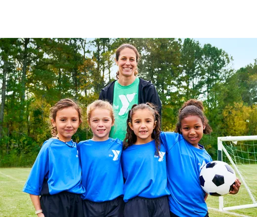 sports coach with kids and soccer