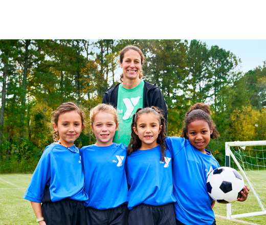 sports coach with kids and soccer