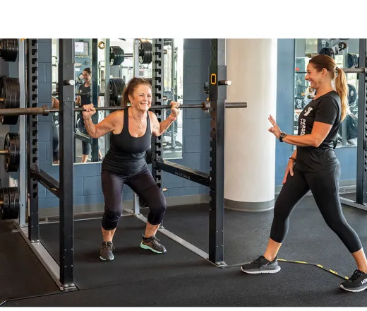 trainer and older women working out