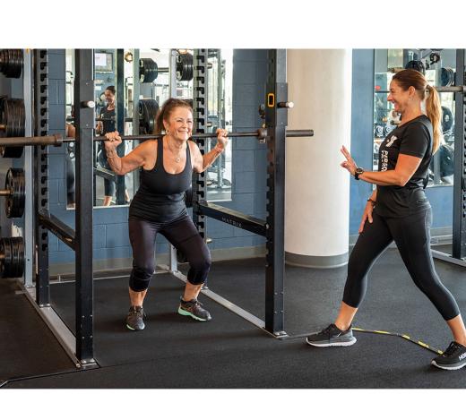 trainer and older women working out