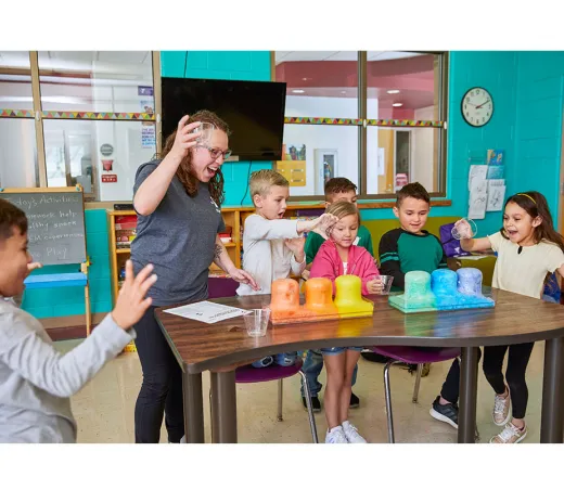 Kids doing a science experiment.