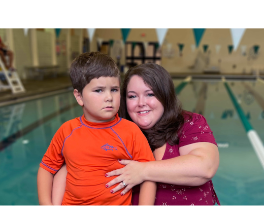 Reid and his mom in front of the pool