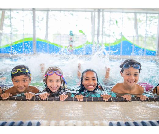 Kids in the pool kicking their feet