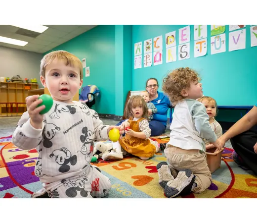 Kids playing with child care staff