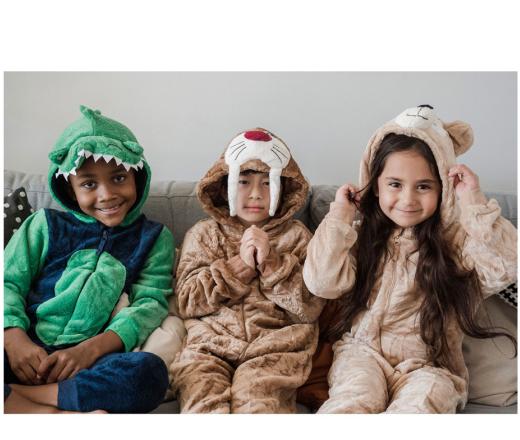 three kids in a dino costume and bear costume