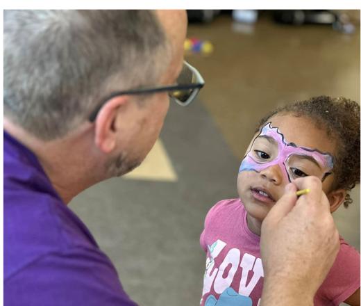 child getting her face painted