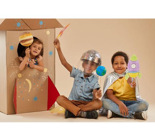 kids playing dress up for space