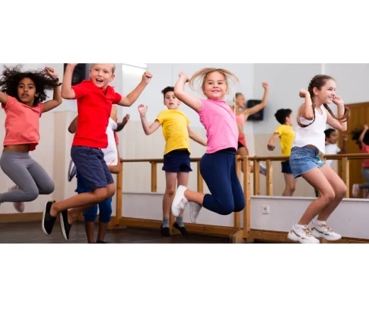 group of kids jumping up and down dancing