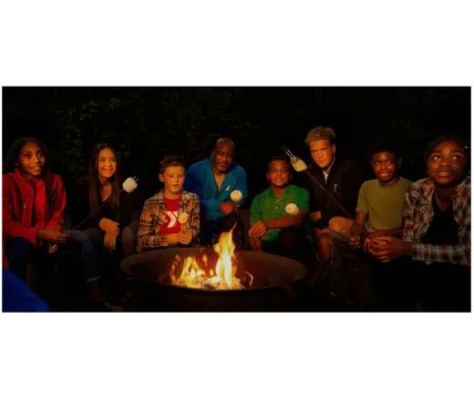 kids gathered around a campfire