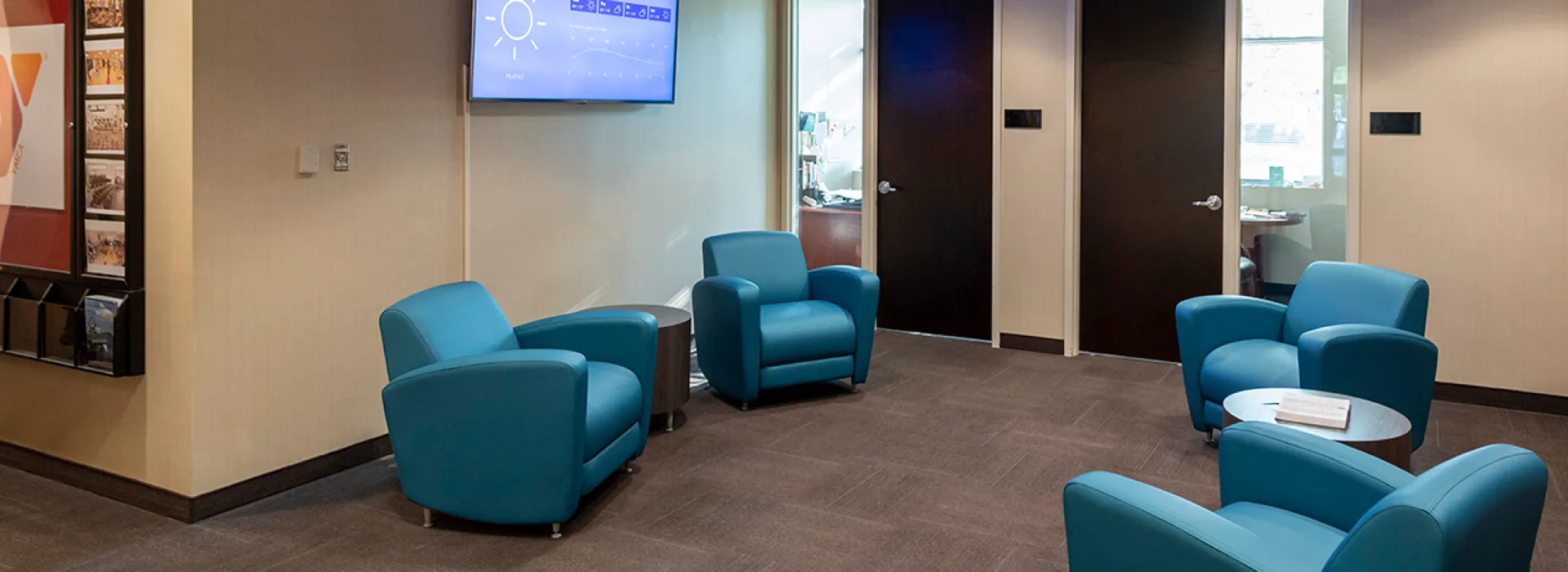 Lobby with chairs and a TV