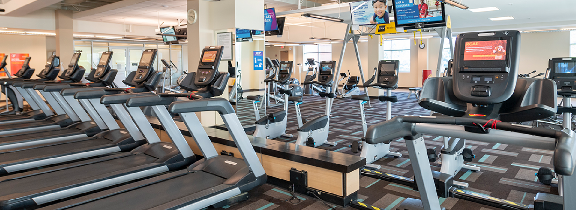 Treadmills lined up on wellness floor